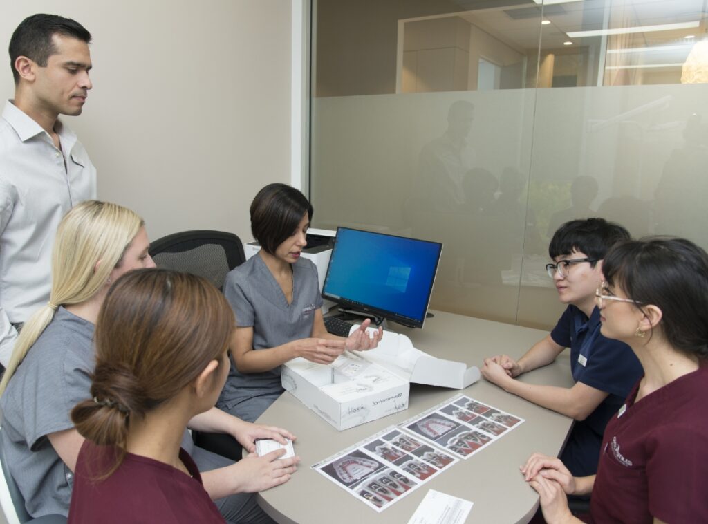 Orthodontist Specialist Clinic Canberra Capital Smiles - Capital Smiles team meeting discussion