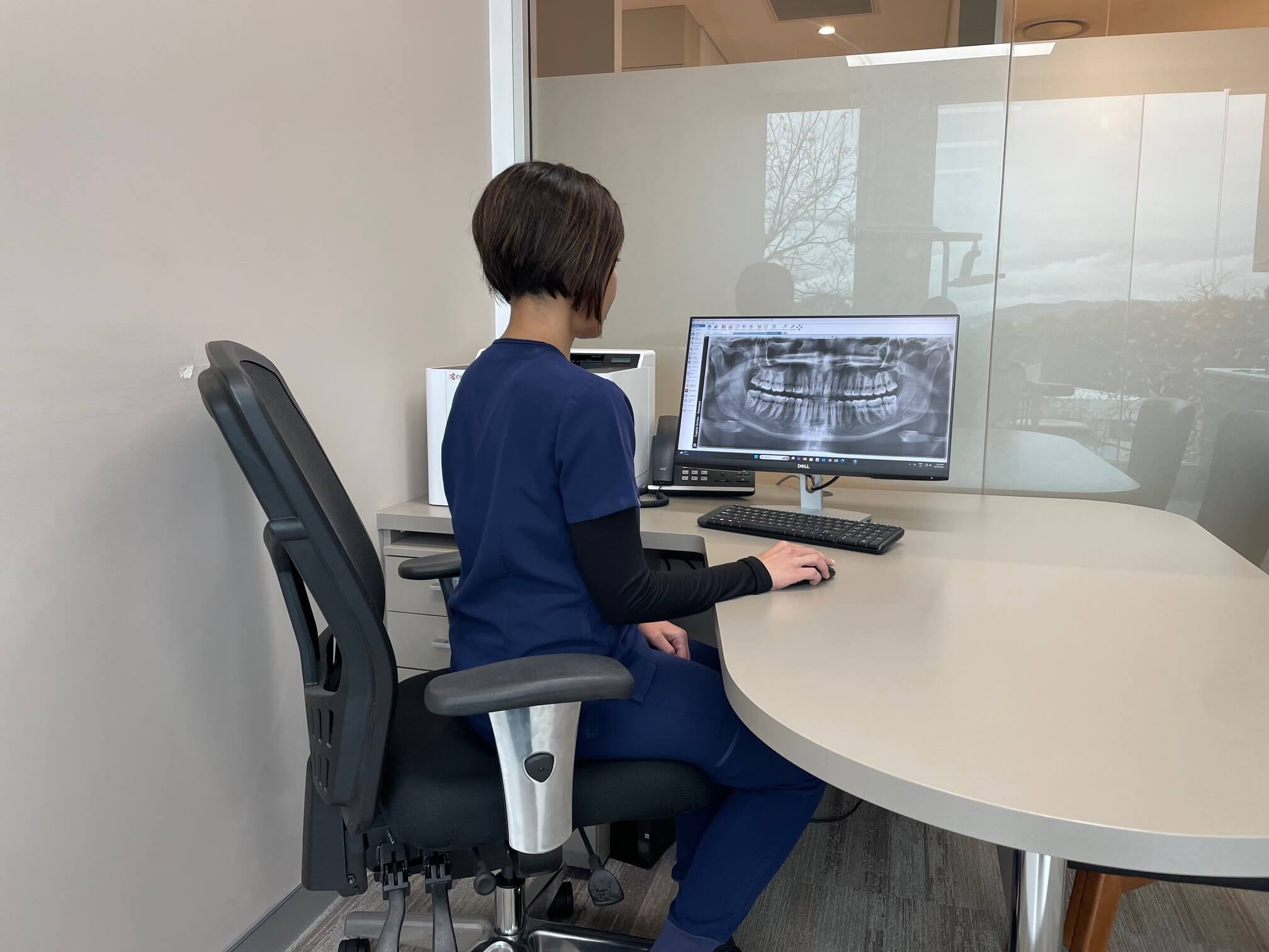 Dr Singh examining teeth x-ray at Capital Smiles Canberra